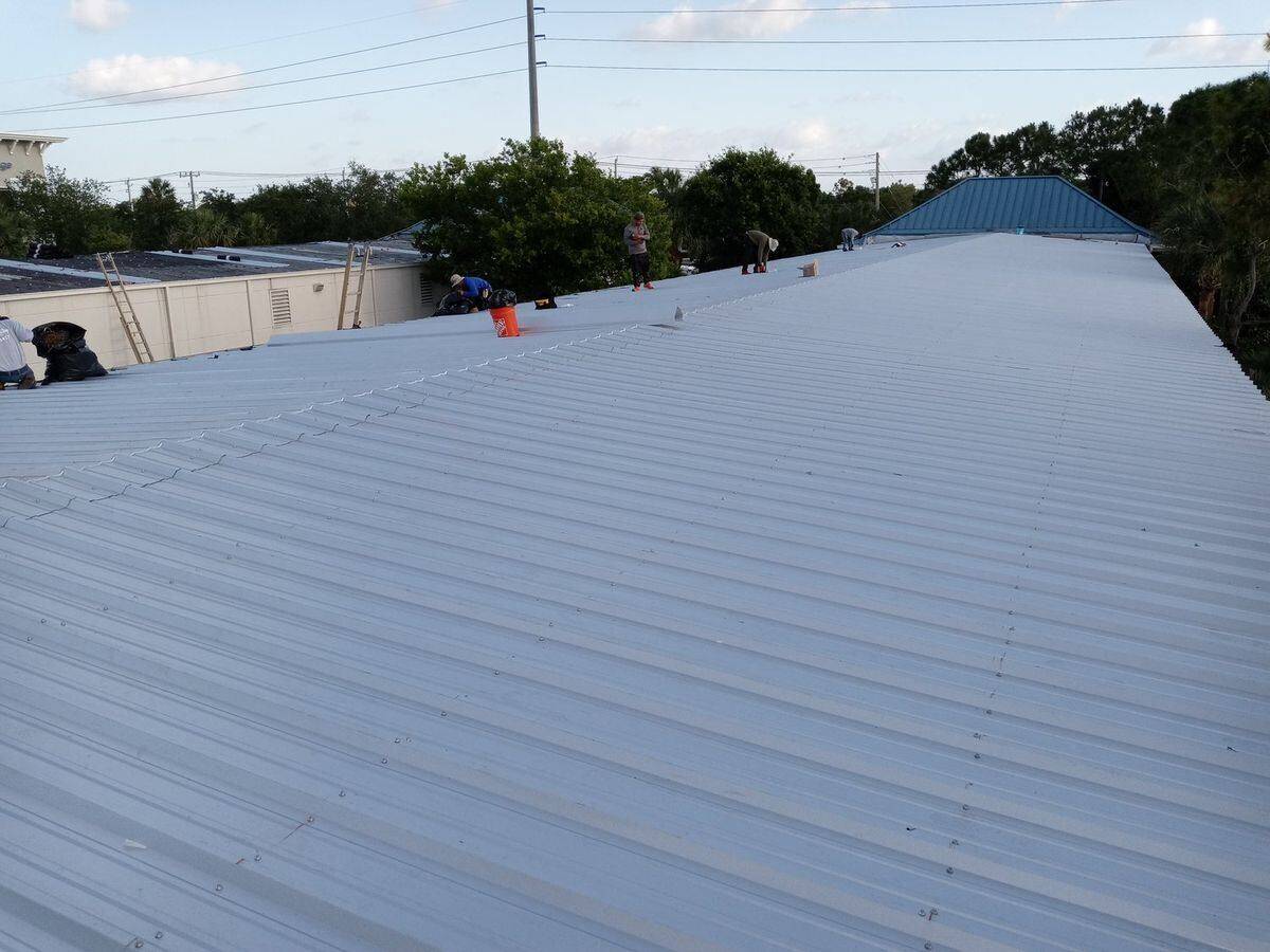 Commercial roof replacement in progress, Goodyear Building Jupiter — Bell Engineering & Construction