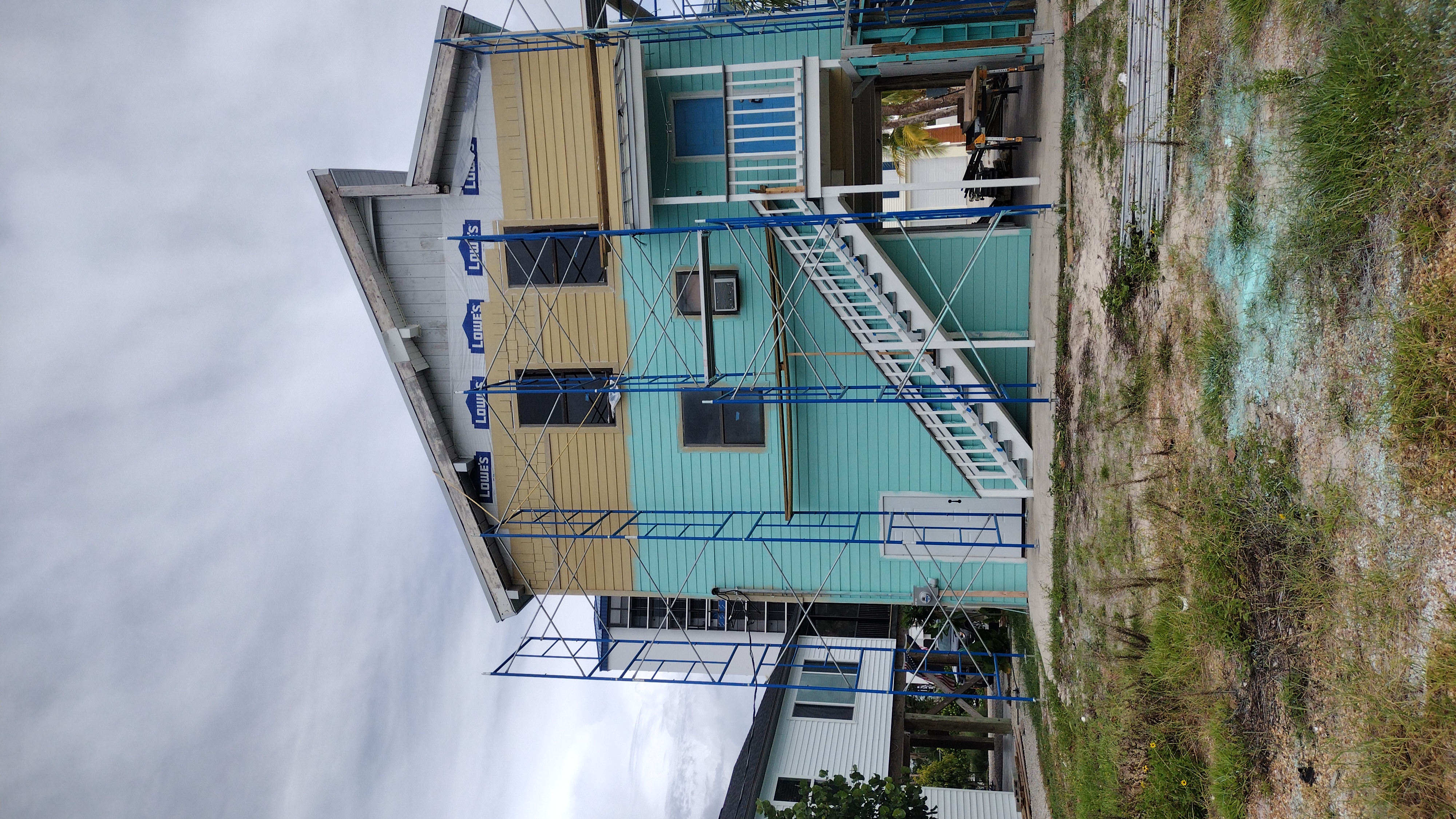 Hardie board installation detail showing the finished two-tone siding pattern — Bell Engineering & Construction