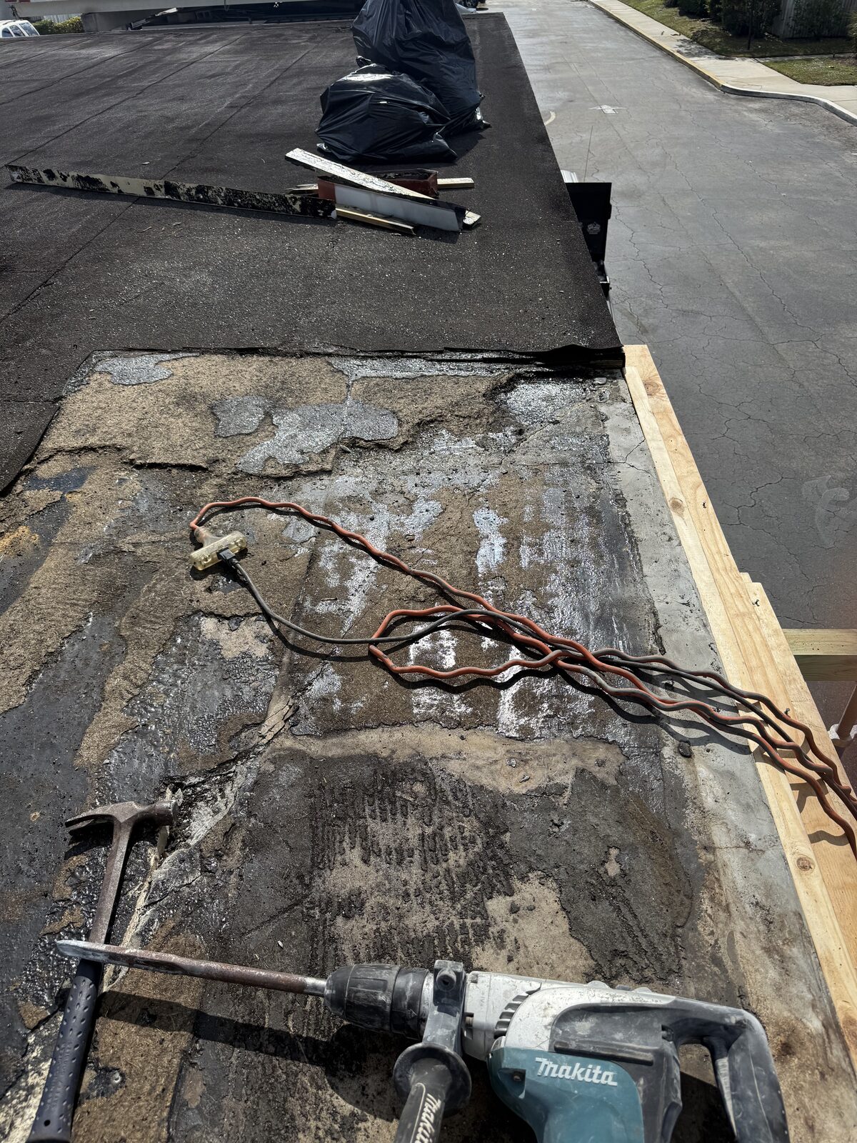 Carport deck demolition down to bare concrete — Bell Engineering & Construction