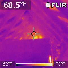 FLIR infrared capture of an attic ridge reading 68.5 degrees Fahrenheit on a 62 to 73 degree scale