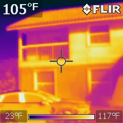 FLIR infrared capture of a two-storey house exterior reading 105 degrees Fahrenheit on a 23 to 117 degree scale