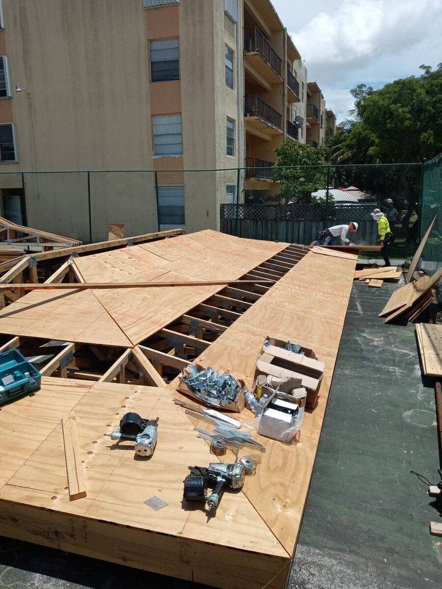 Framing crew building a roof